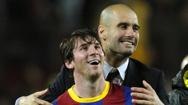 zzzzinte1Barcelona's coach Josep Guardiola (R) celebrates with Barcelona's Argentinian forward Lionel Messi after  the Champions League semi-final second leg football match between Barcelona and Real Madrid at the Camp Nou stadium in Barcelona on May 3, 2011. Barcelona qualified for the Champions League final after drawing 1-1 in their semi-final second leg clash with bitter rivals Real Madrid to progress 3-1 on aggregate.  AFP PHOTO/JAVIER SORIANOzzzz