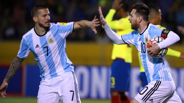 QUITO, ECUADOR - OCTOBER 10:  Lionel Messi of Argentina celebrates with teammate Dario Benedetto after scoring the first goal of his team during a match between Ecuador and Argentina as part of FIFA 2018 World Cup Qualifiers at Olimpico Atahualpa Stadium on October 10, 2017 in Quito, Ecuador. (Photo by Hector Vivas/Getty Images)-Not Released (NR)